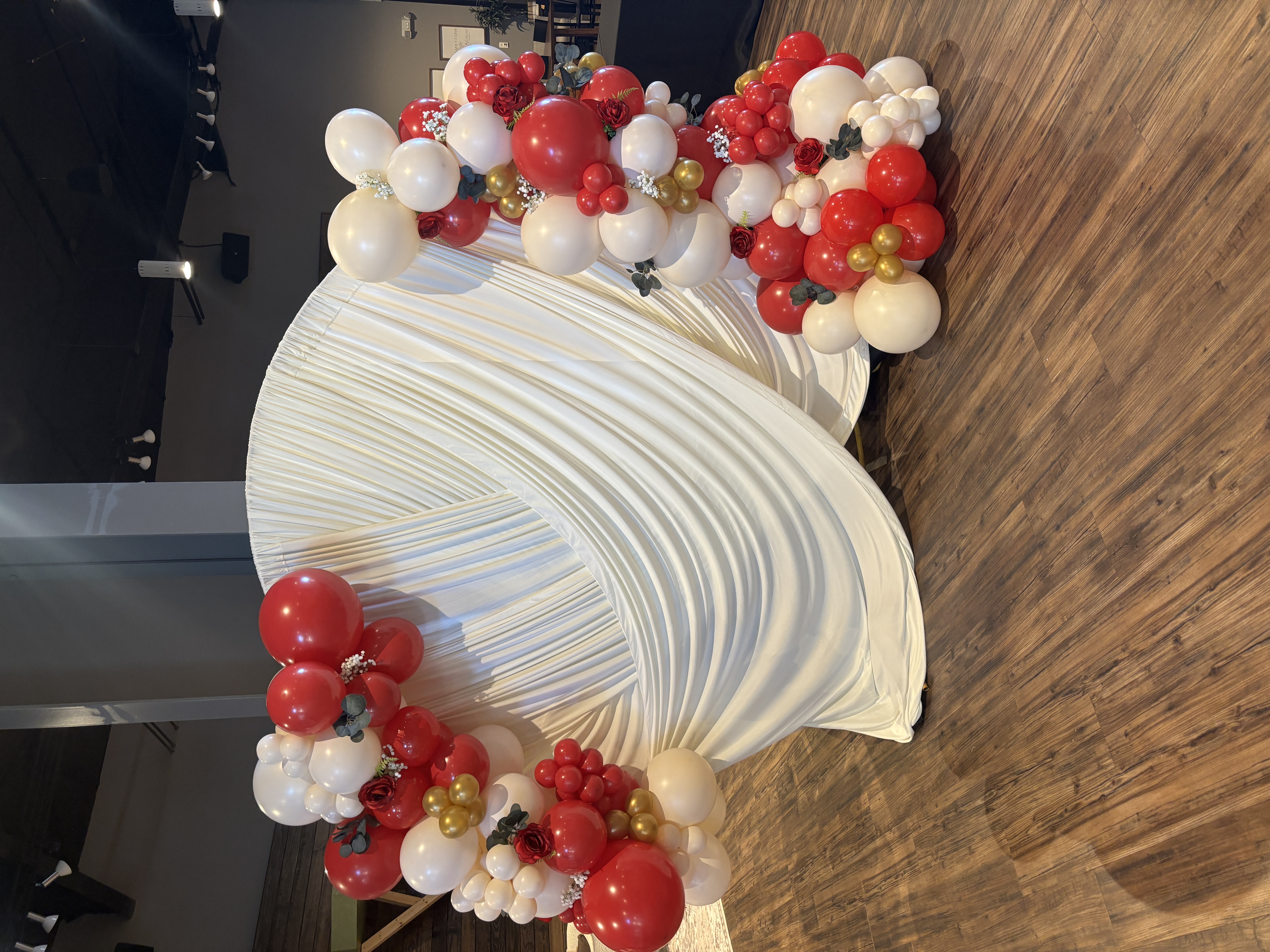Close-up of plum, sage, and cream balloon garland on a staircase