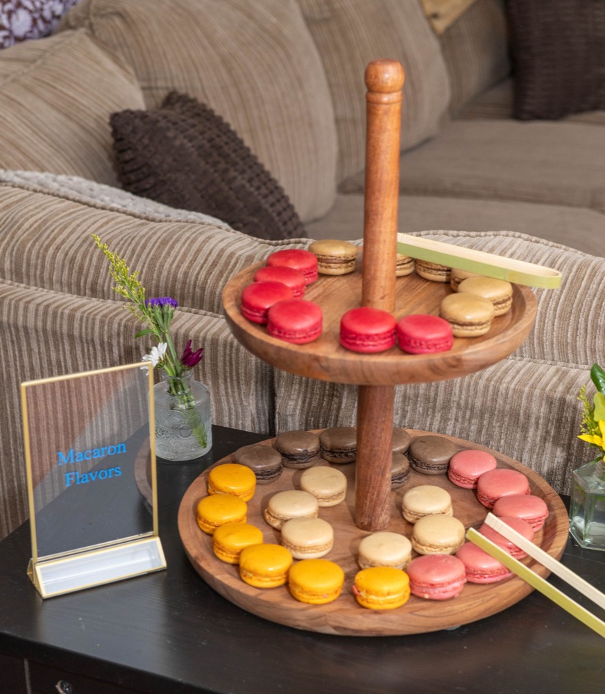 Two-tiered macaron stand with assorted flavors